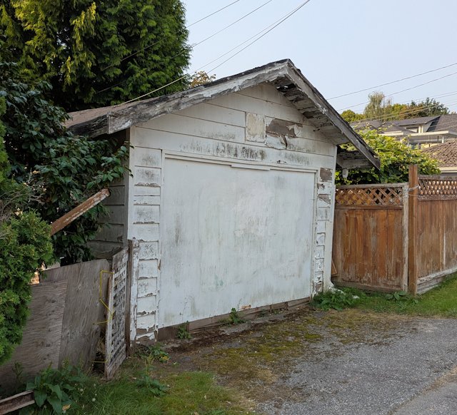 rundown shed with paint peeling off