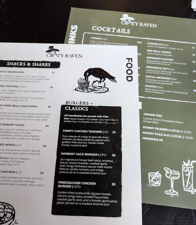a menu from the Crazy Raven resturant featuring a raven eating fries