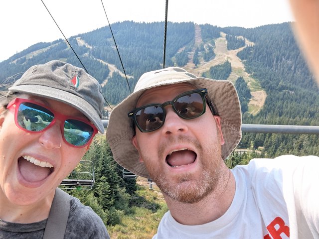 Josh and Stacey making aaaahh-freaked-out faces while riding a ski lift