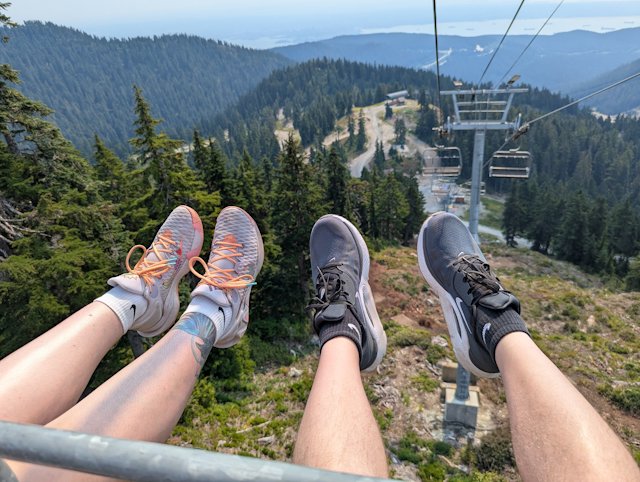 kicking out our feet with fir trees in the background