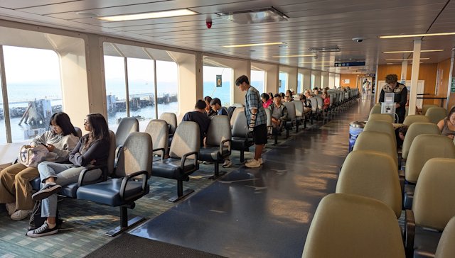 rows of seats with a view out the window along the sides of deck 5