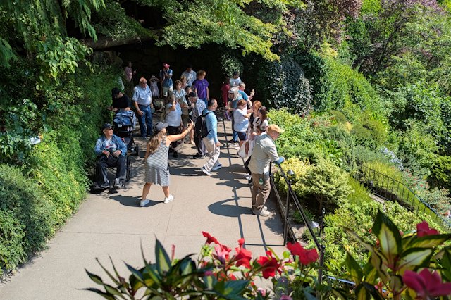 A crowd of people taking picture over the sunken gardens