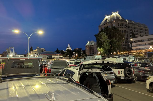 lines of cars waiting to board the ferry and getting inspected by customs